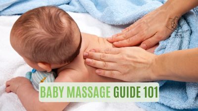A parent gently massaging their baby on a soft towel, creating a bonding and relaxing moment.