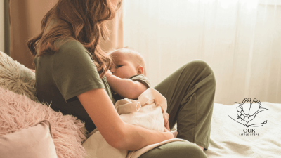 Mother breastfeeding her baby while sitting on a cozy chair, representing a guide to breastfeeding and baby nutrition.