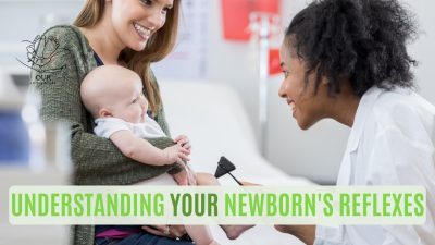 Newborn baby gripping a parent's finger, demonstrating natural reflexes.