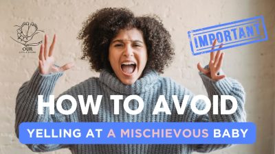 A patient mother kneeling beside her curious baby, gently redirecting them with a warm smile.